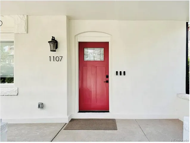 a kitchen with cabinets stainless steel appliances and a window