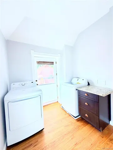 a bedroom with a bed and a mirror