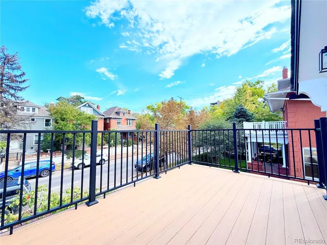 a view of a two chairs on the roof deck