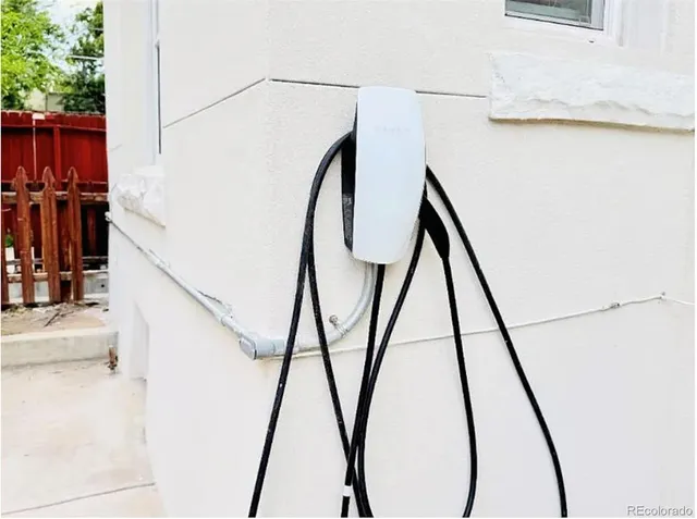 a view of house with backyard and sitting area