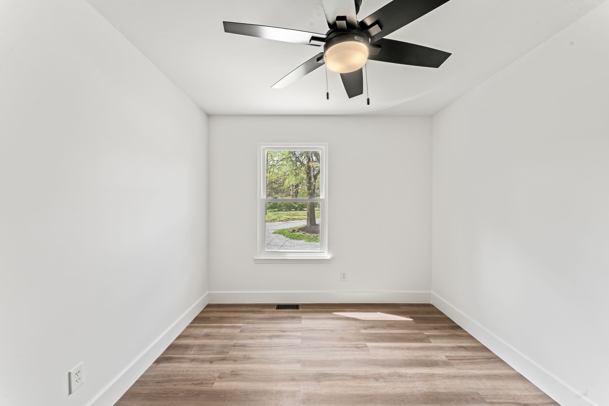 841 Neelys Bend Road Madison, TN 37115 - Photo 13 of 17 an empty room with a window and a ceiling fan