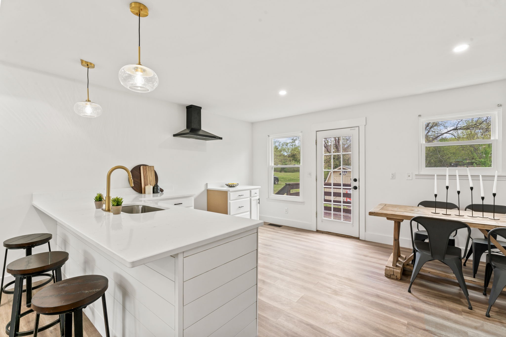 841 Neelys Bend Road Madison, TN 37115 - Photo 5 of 17 a kitchen with stainless steel appliances a table and chairs in it