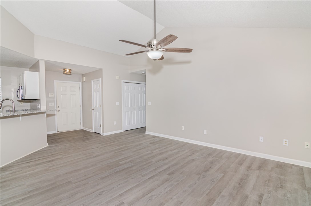 102 Hawk Ridge Drive Anderson, SC 29621 - Photo 29 of 38 This living space features high ceilings and modern flooring, creating an inviting and airy atmosphere.