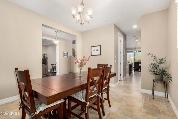 a kitchen with granite countertop kitchen island stainless steel appliances a sink stove and cabinets