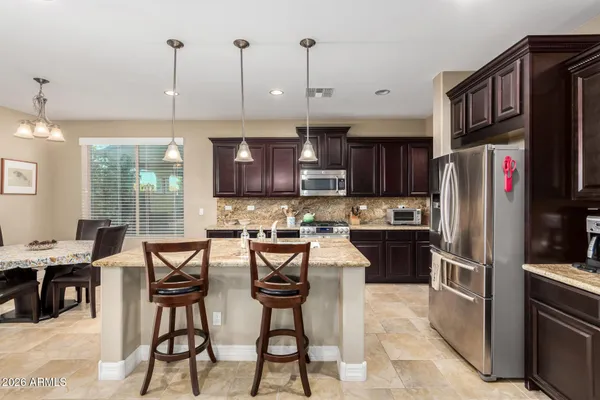 a bedroom with a bed and a television