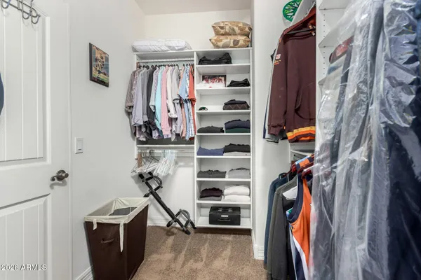 a spacious bedroom with a bed and window