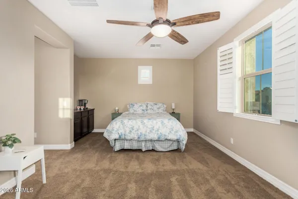 a view of house with swimming pool and outdoor seating