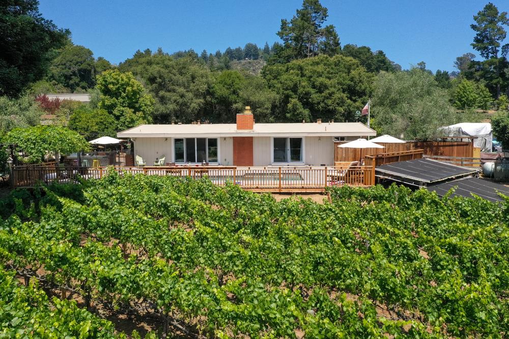 377 Brooktree Ranch Road Aptos, CA 95003 - Photo 1 of 50 a view of a house with a backyard and sitting area
