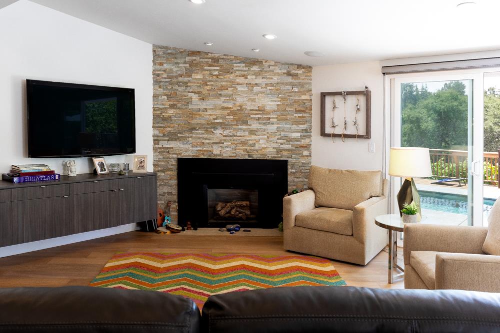 377 Brooktree Ranch Road Aptos, CA 95003 - Photo 15 of 50 a living room with a flat screen tv and a fireplace