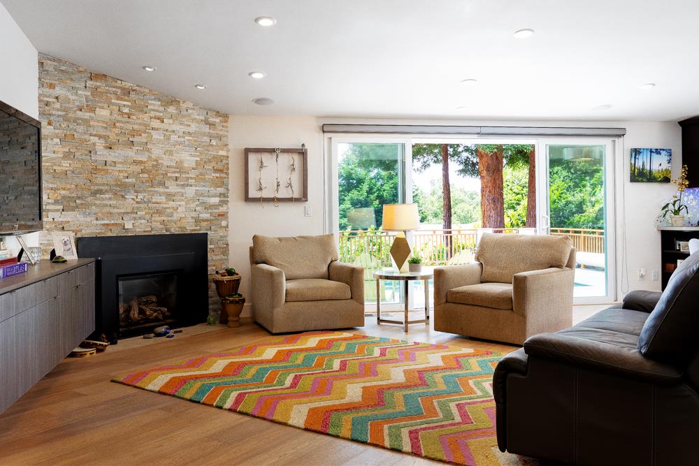 377 Brooktree Ranch Road Aptos, CA 95003 - Photo 16 of 50 a living room with furniture and a fireplace