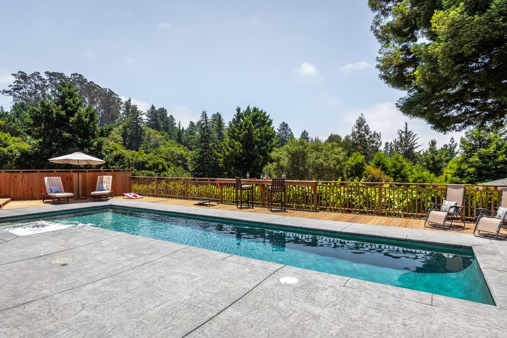 377 Brooktree Ranch Road Aptos, CA 95003 - Photo 18 of 50 a view of a swimming pool with a yard