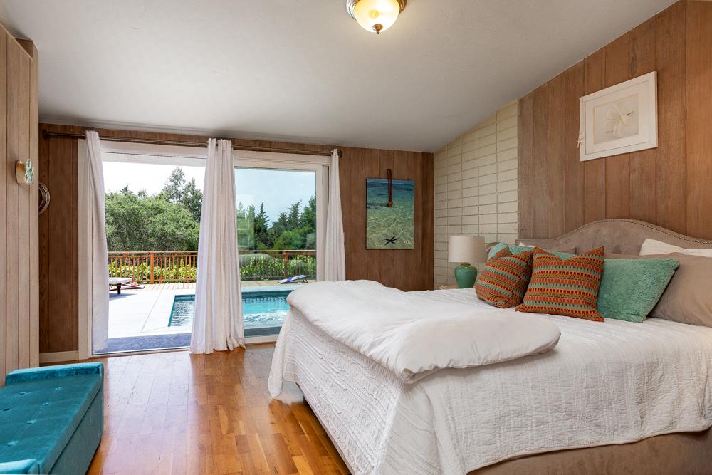 377 Brooktree Ranch Road Aptos, CA 95003 - Photo 20 of 50 a bedroom with a large bed and a large window