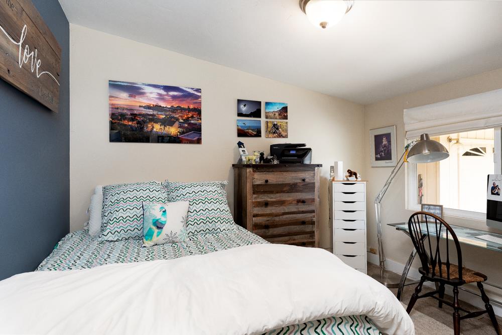 377 Brooktree Ranch Road Aptos, CA 95003 - Photo 23 of 50 a bedroom with a bed and furniture