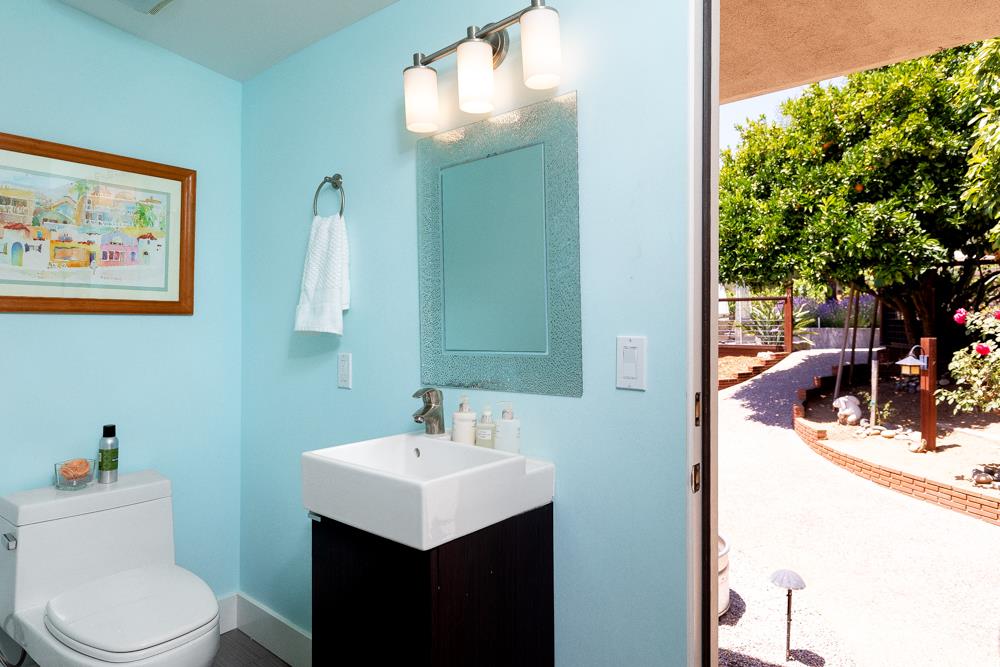 377 Brooktree Ranch Road Aptos, CA 95003 - Photo 26 of 50 a bathroom with a sink a mirror and a toilet