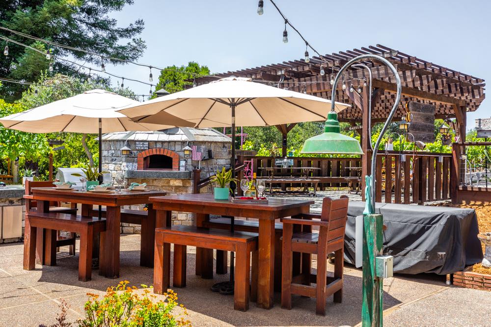 377 Brooktree Ranch Road Aptos, CA 95003 - Photo 29 of 50 a view of a chairs and table under an umbrella