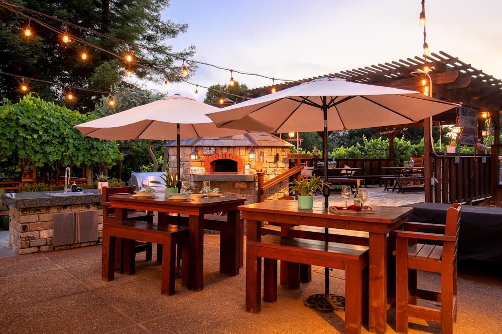 377 Brooktree Ranch Road Aptos, CA 95003 - Photo 6 of 50 a view of patio with chairs and table under an umbrella