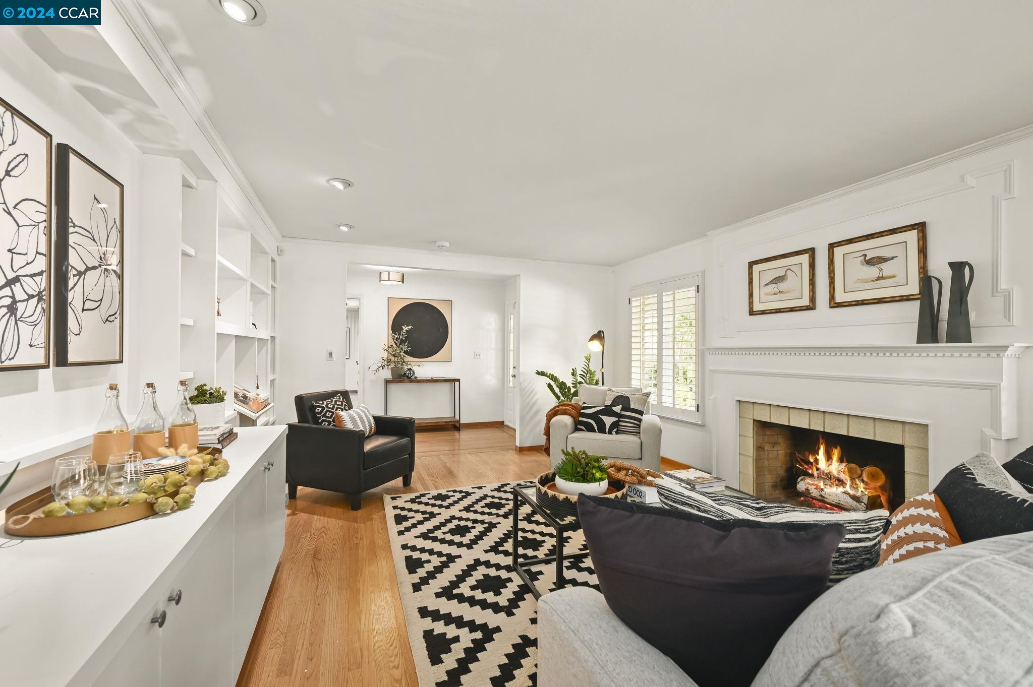 3 Burnt Oak Circle Lafayette, CA 94549 - Photo 1 of 1 a living room with furniture fireplace and a large window