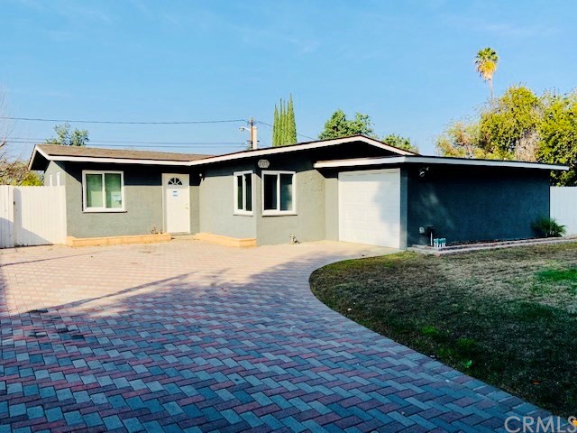 7455 Santa Rosa Way Riverside, CA 92504 - Photo 1 of 1 a front view of a house with a yard