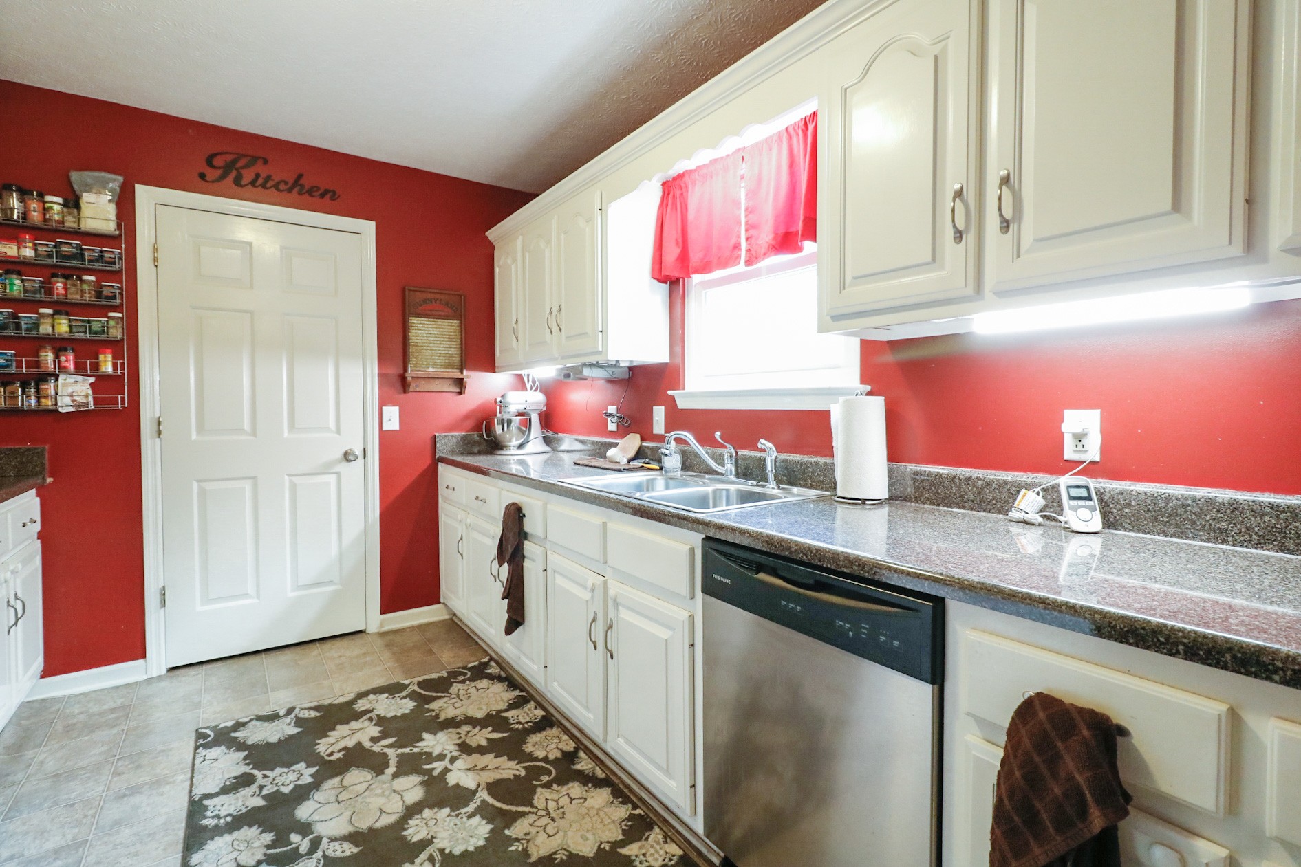 2279 South Williams Road Greenbrier, TN 37073 - Photo 11 of 28 a kitchen with stainless steel appliances granite countertop a sink stove and cabinets