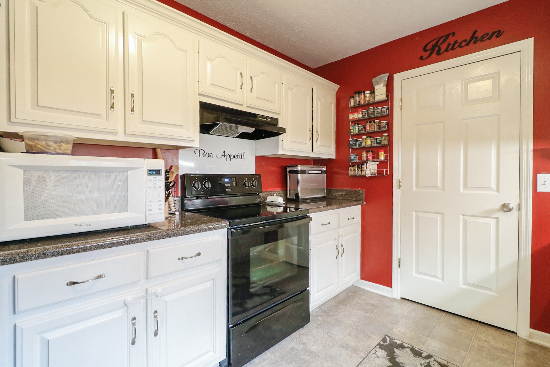 2279 South Williams Road Greenbrier, TN 37073 - Photo 10 of 28 a kitchen with stainless steel appliances granite countertop a stove a sink and a microwave