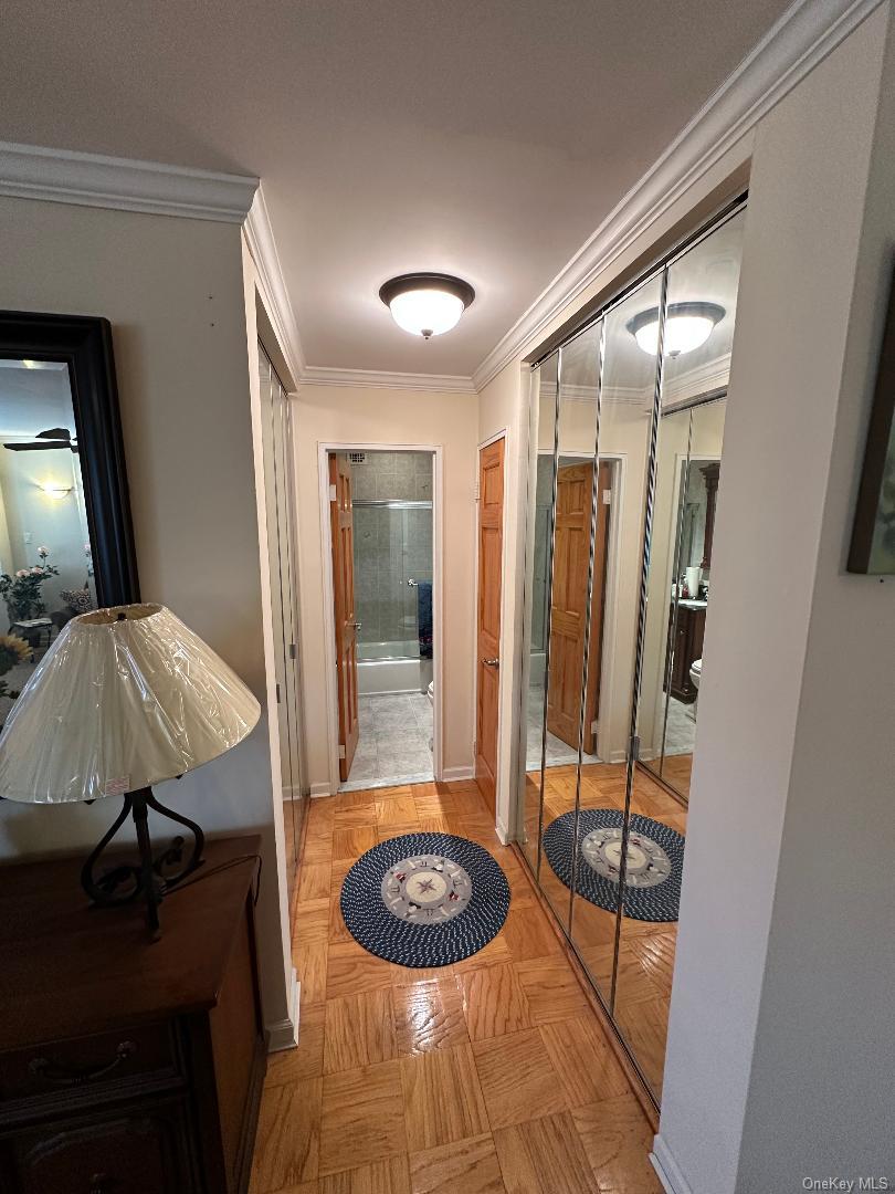 770 Shore Road, Unit 6EE Long Beach, NY 11561 - Photo 9 of 13 Hallway with ornamental molding