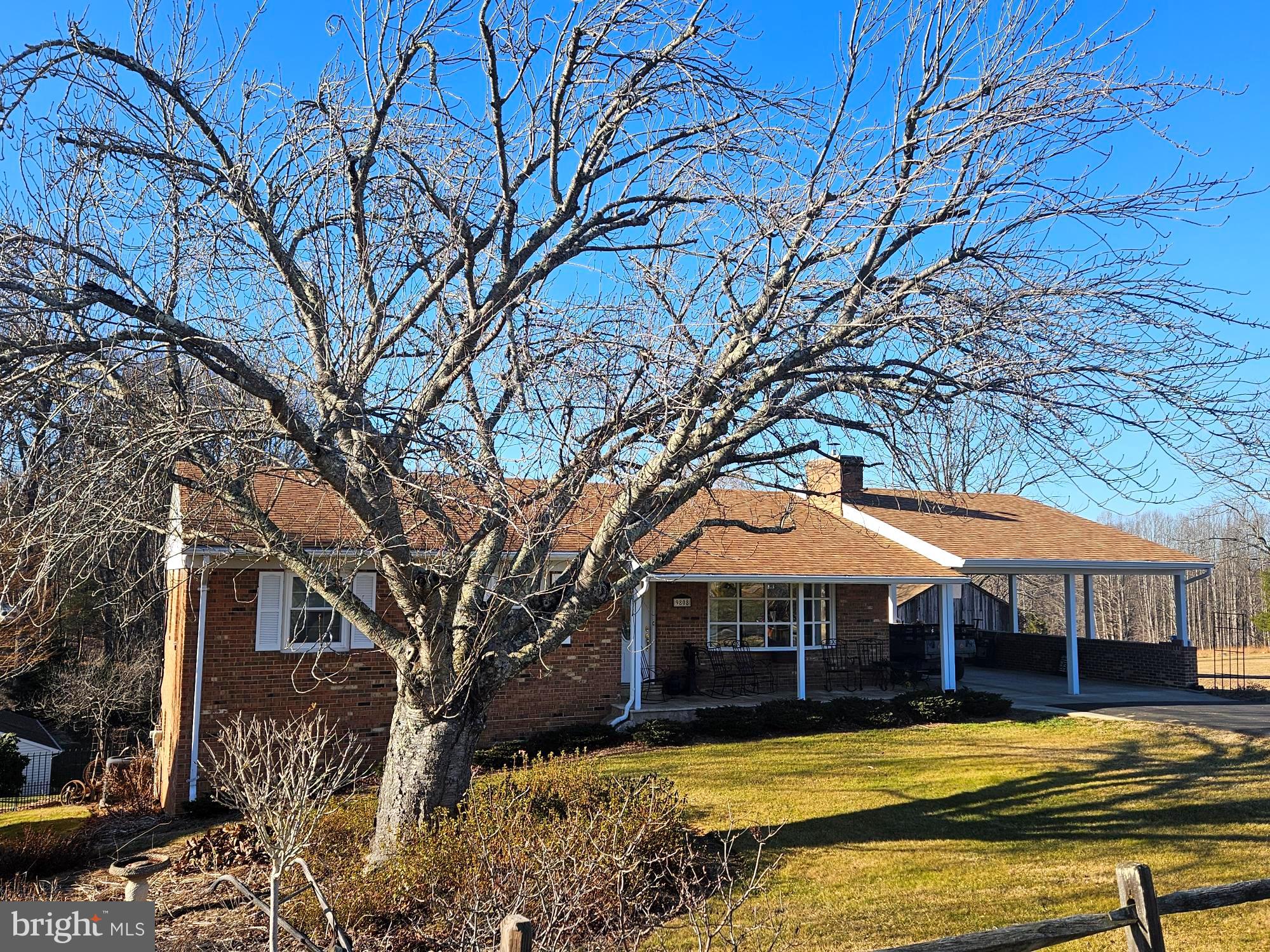 9808 Evans Ford Road Manassas, VA 20111 - Photo 1 of 3 a front view of a house with a yard