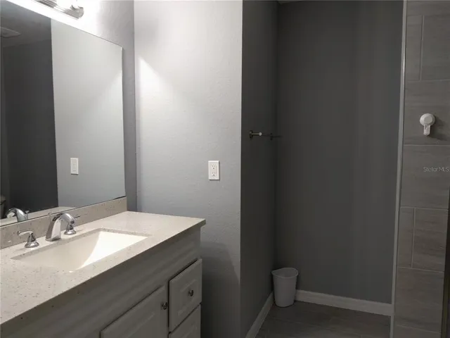 a bathroom with a sink and a toilet