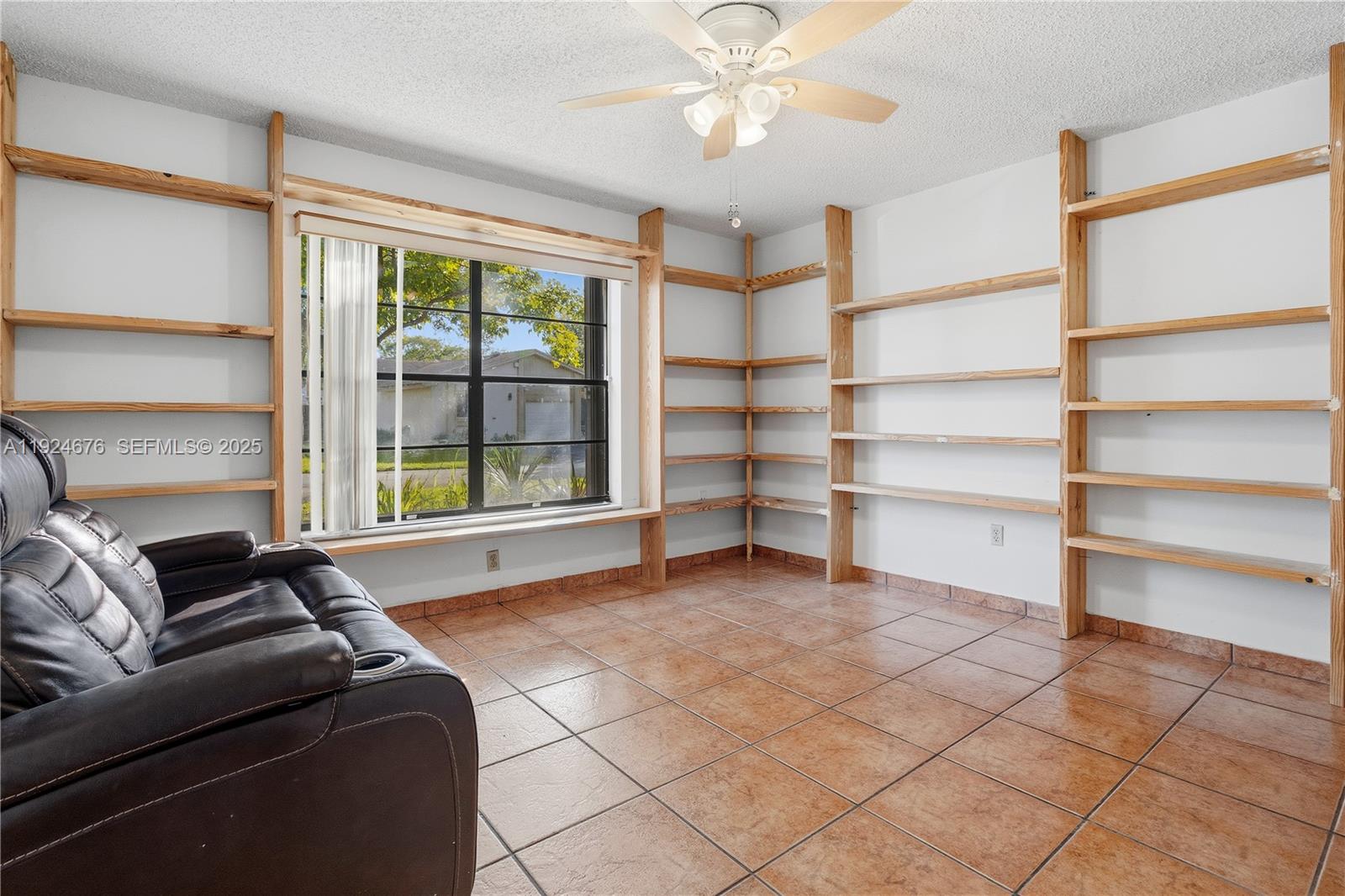 13585 Southwest 114th Terrace Miami, FL 33186 - Photo 23 of 42 a living room with furniture and a large window