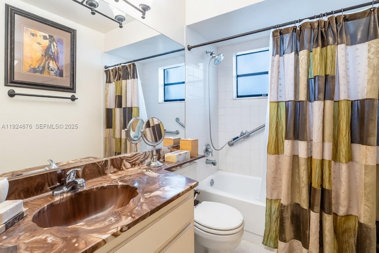 13585 Southwest 114th Terrace Miami, FL 33186 - Photo 27 of 42 a bathroom with a sink a toilet and a bathtub