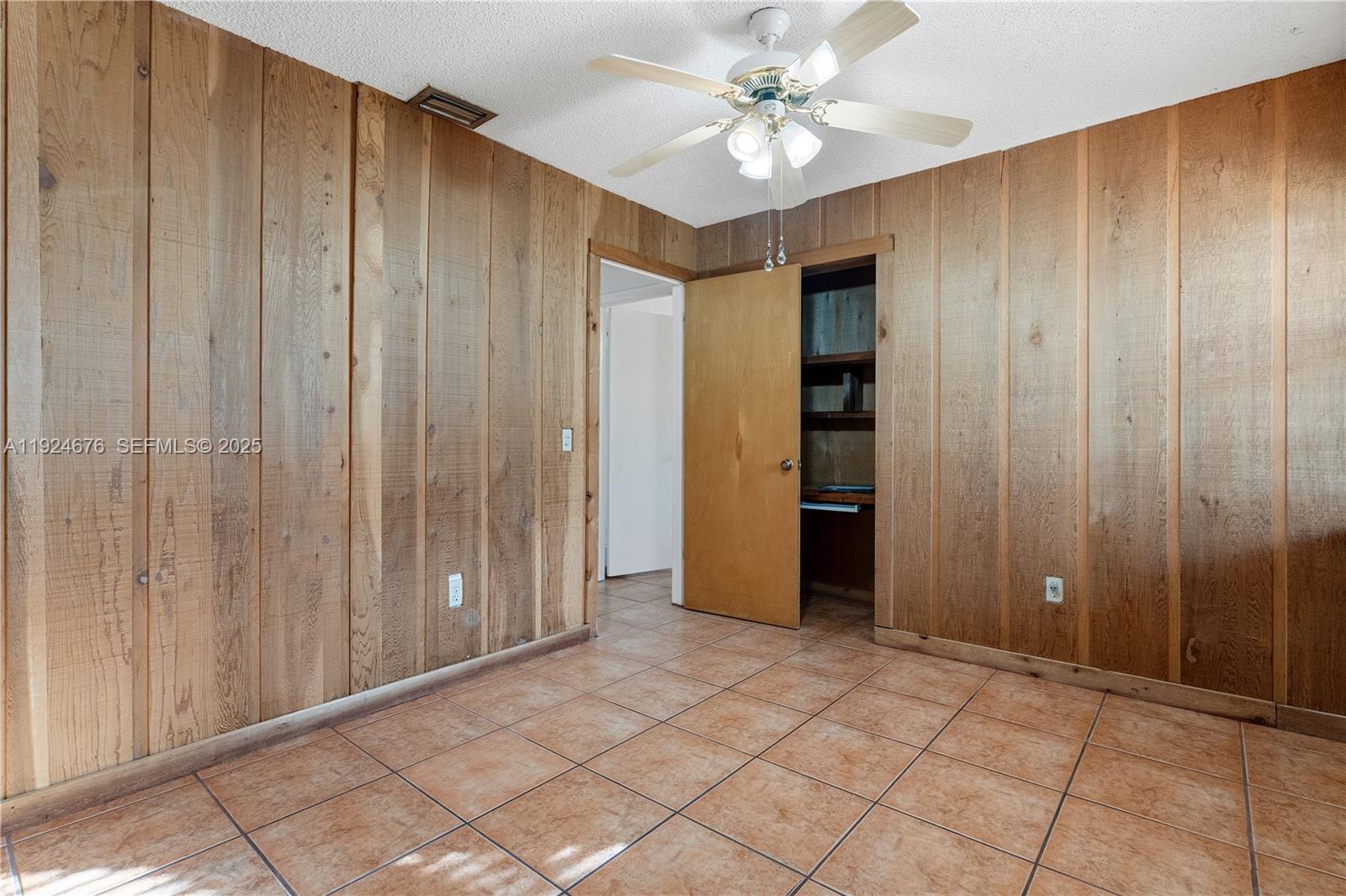 13585 Southwest 114th Terrace Miami, FL 33186 - Photo 30 of 42 an empty room with closet area