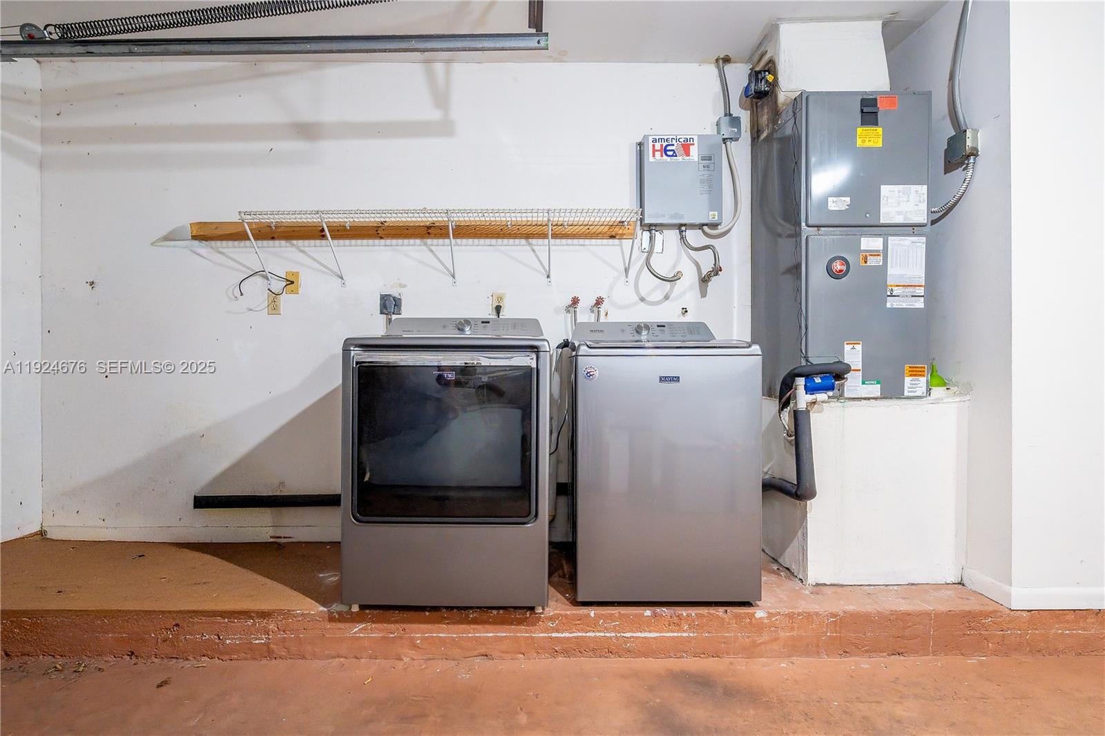 13585 Southwest 114th Terrace Miami, FL 33186 - Photo 41 of 42 a utility room with cabinets washer and dryer