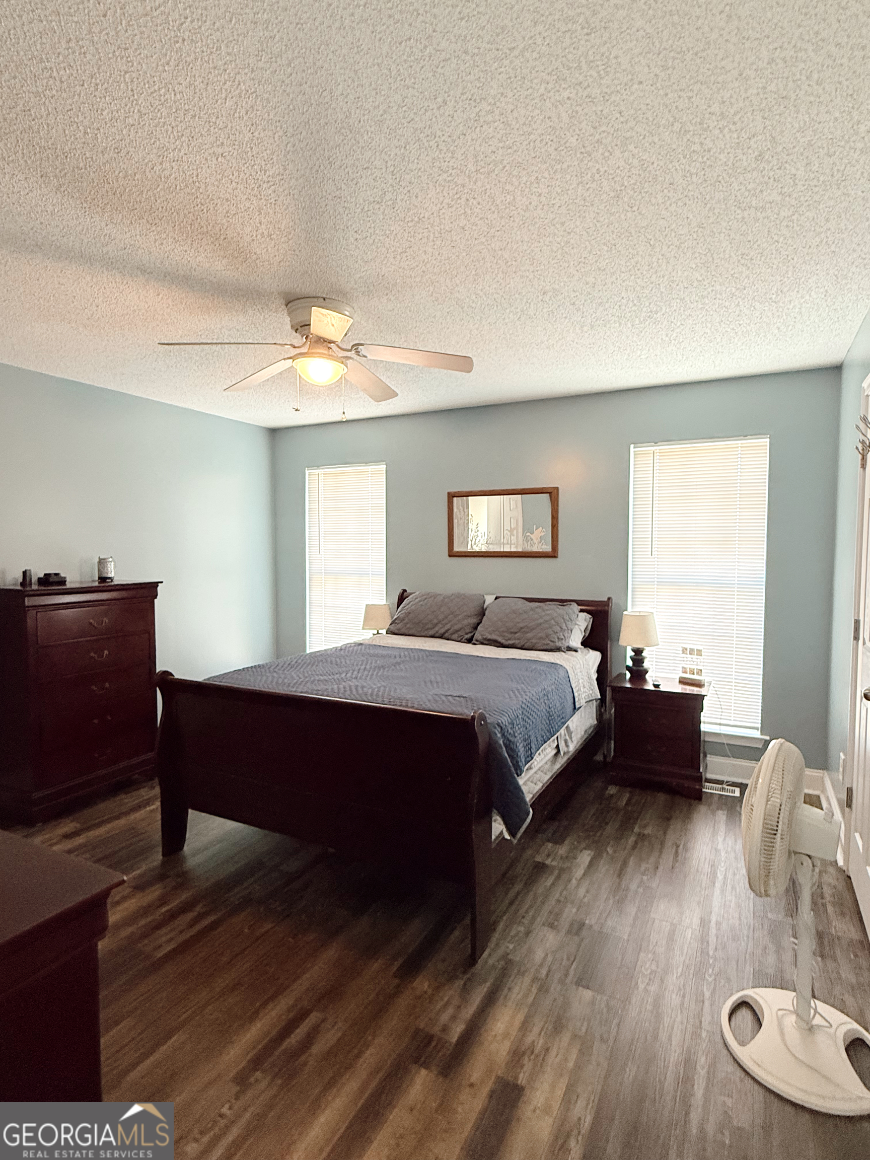 44 Quail Knoll Lane Cleveland, GA 30528 - Photo 16 of 42 a bed room with a bed and a chair