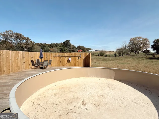 a view of a swimming pool with a terrace