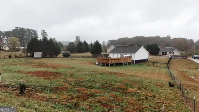 a view of a patio with couches chairs and a yard