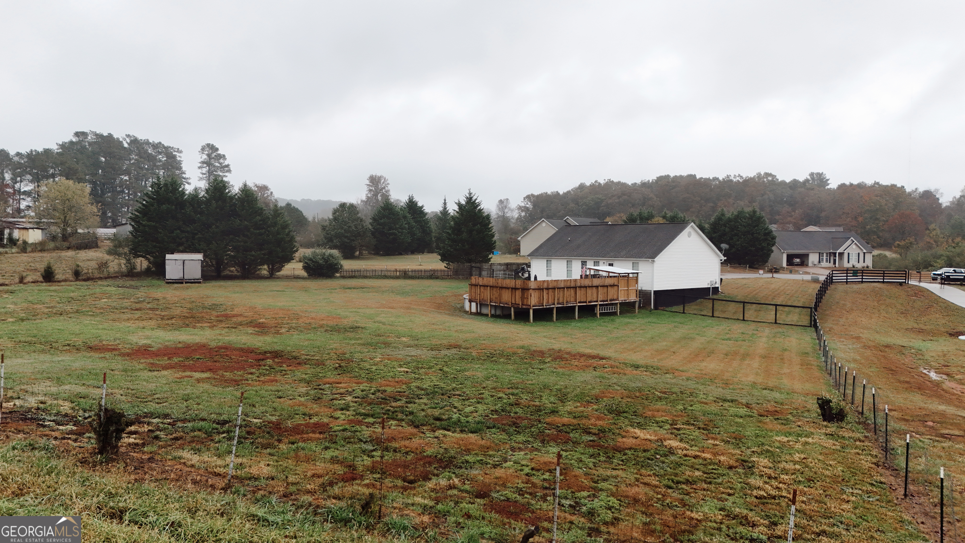 44 Quail Knoll Lane Cleveland, GA 30528 - Photo 37 of 42 a view of a house with a yard and sitting area