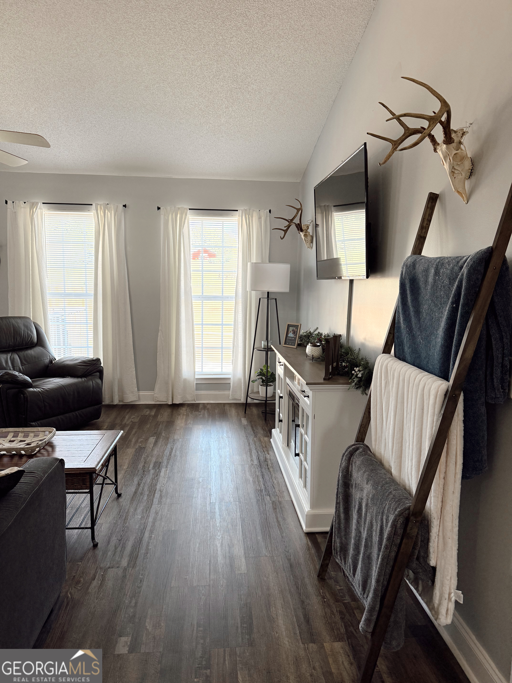 44 Quail Knoll Lane Cleveland, GA 30528 - Photo 4 of 42 a living room with furniture and a wooden floor