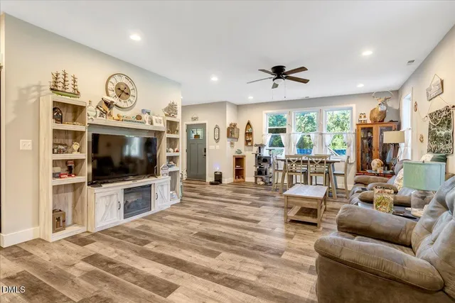 a kitchen with refrigerator a stove a sink and cabinets