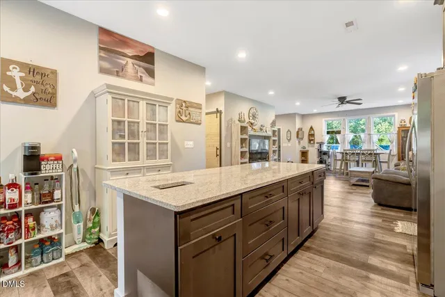 a kitchen with granite countertop a sink and a window