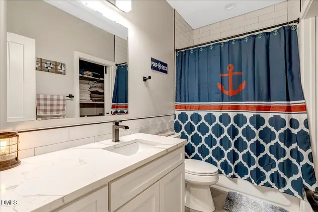 a bedroom with a bed and a mirror