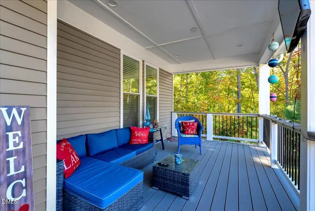 a view of a house with a yard and sitting area