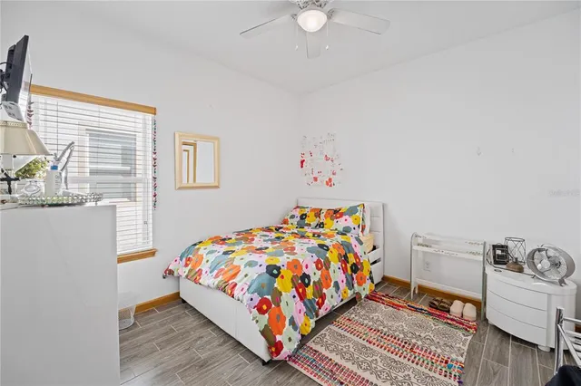 a bedroom with bed and window