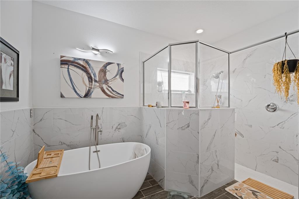 1722 Reflection Lane St. Cloud, FL 34771 - Photo 19 of 26 a bathroom with a bathtub a window and shower