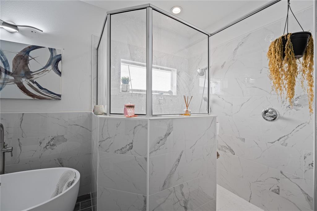 1722 Reflection Lane St. Cloud, FL 34771 - Photo 20 of 26 a bathroom with a shower and a tub