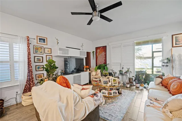 a living room with furniture or couch and a large window