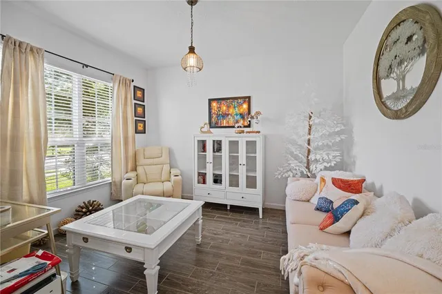 a living room with furniture and a window