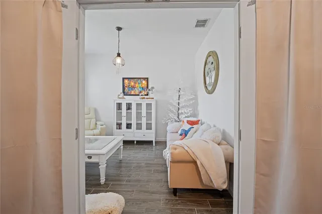 a living room with furniture and a window