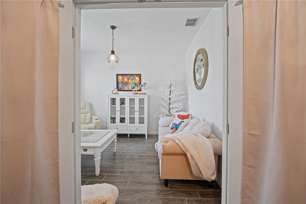 1722 Reflection Lane St. Cloud, FL 34771 - Photo 6 of 26 a living room with furniture and a window