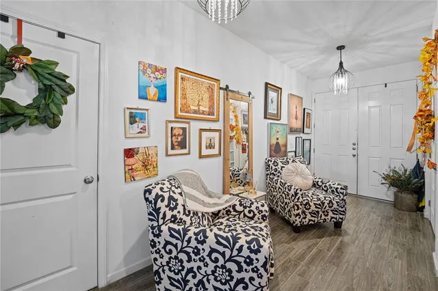 a bedroom with furniture and a chandelier