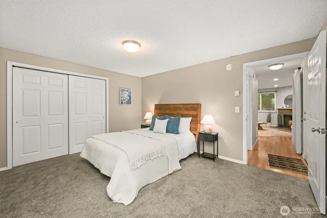 a bedroom with a bed and lamp