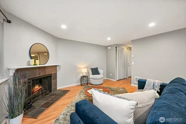 a living room with furniture and a fireplace